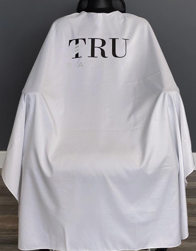 TRUBARBER PROFESSIONAL BARBER CAPE – White With Black Letters